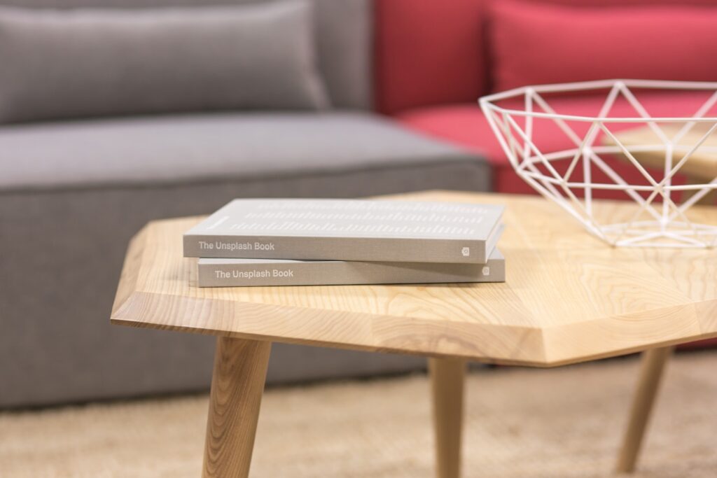 two gray books on brown wooden table