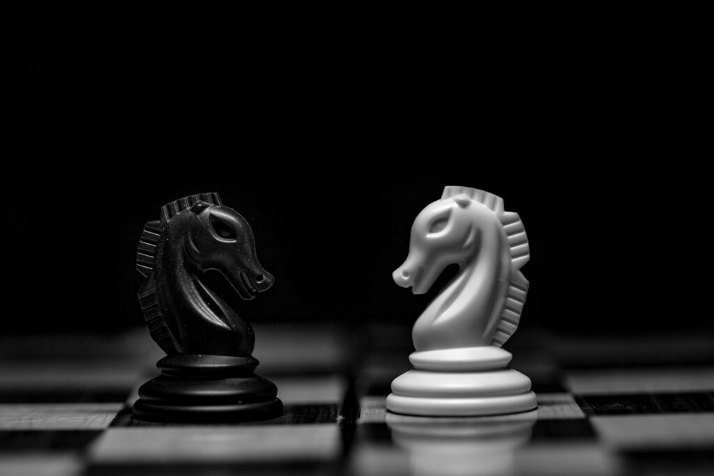 white ceramic figurine on black table